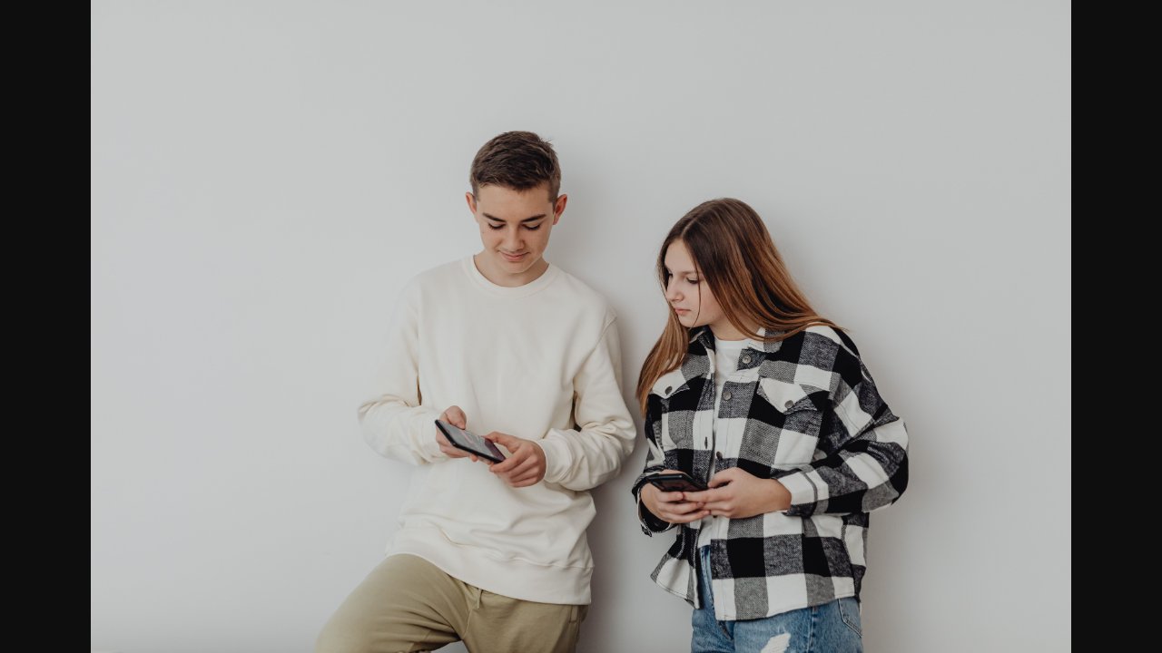 Child using a smartphone, illustrating the reality of young people and social media today